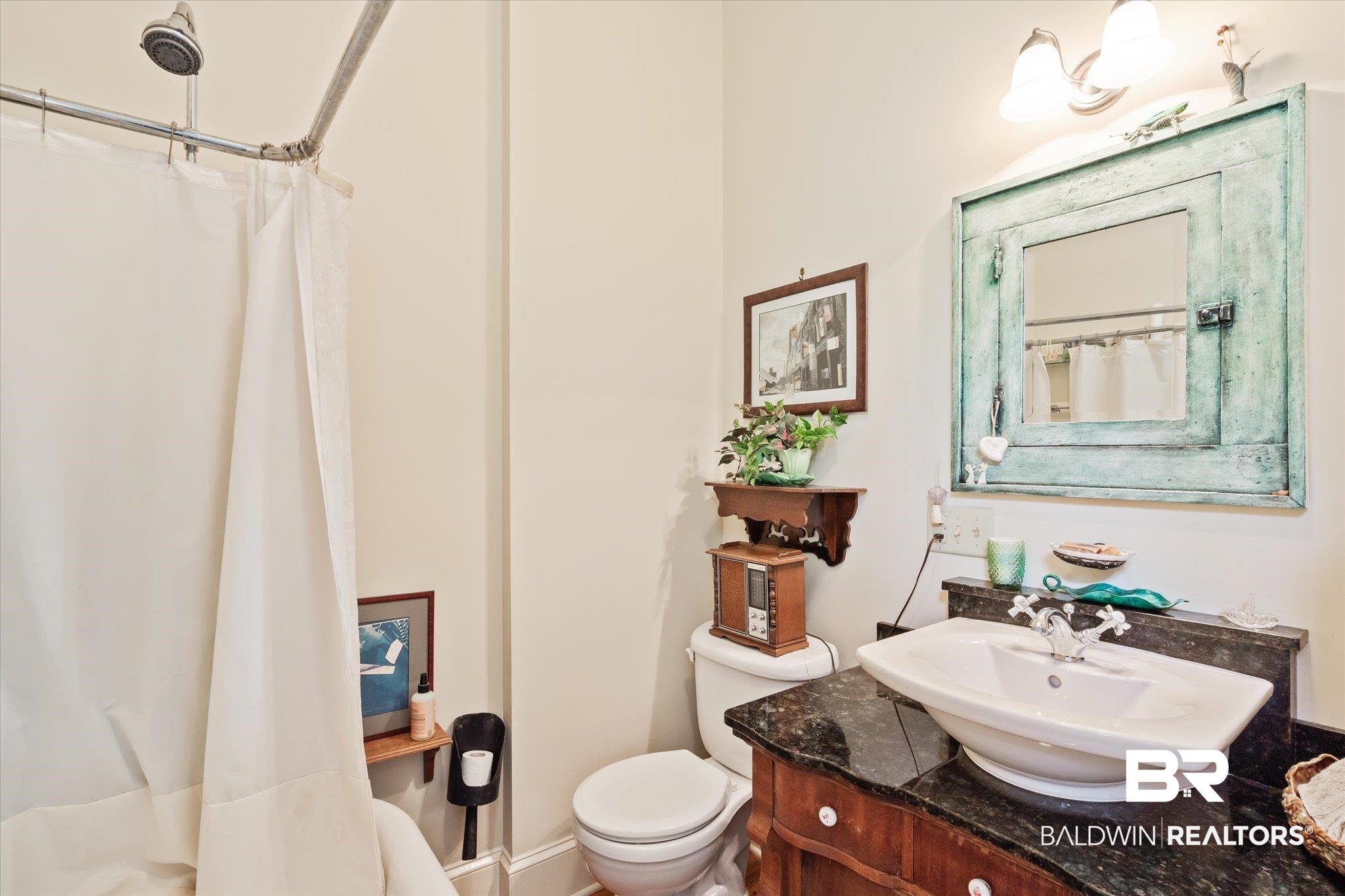 12 Lebaron Street Mobile, AL 36602 - Photo 24 of 37 Bathroom with a shower with curtain, vanity, and toilet