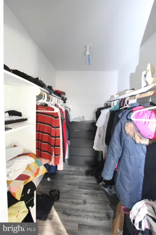a bedroom with a bed and a closet