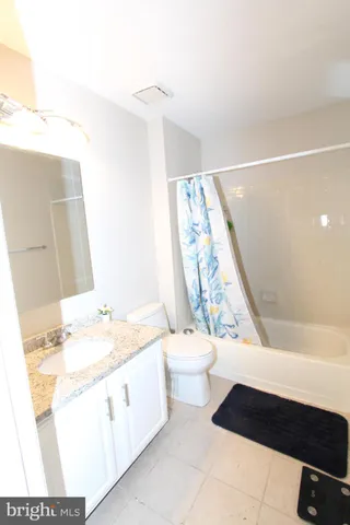 a bathroom with a sink a toilet and a bathtub