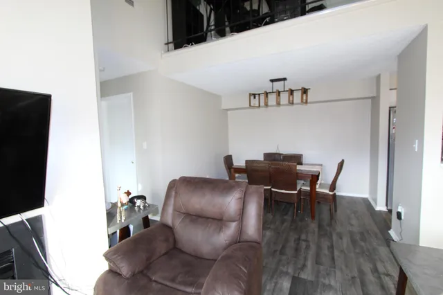 a workspace with furniture and wooden floor