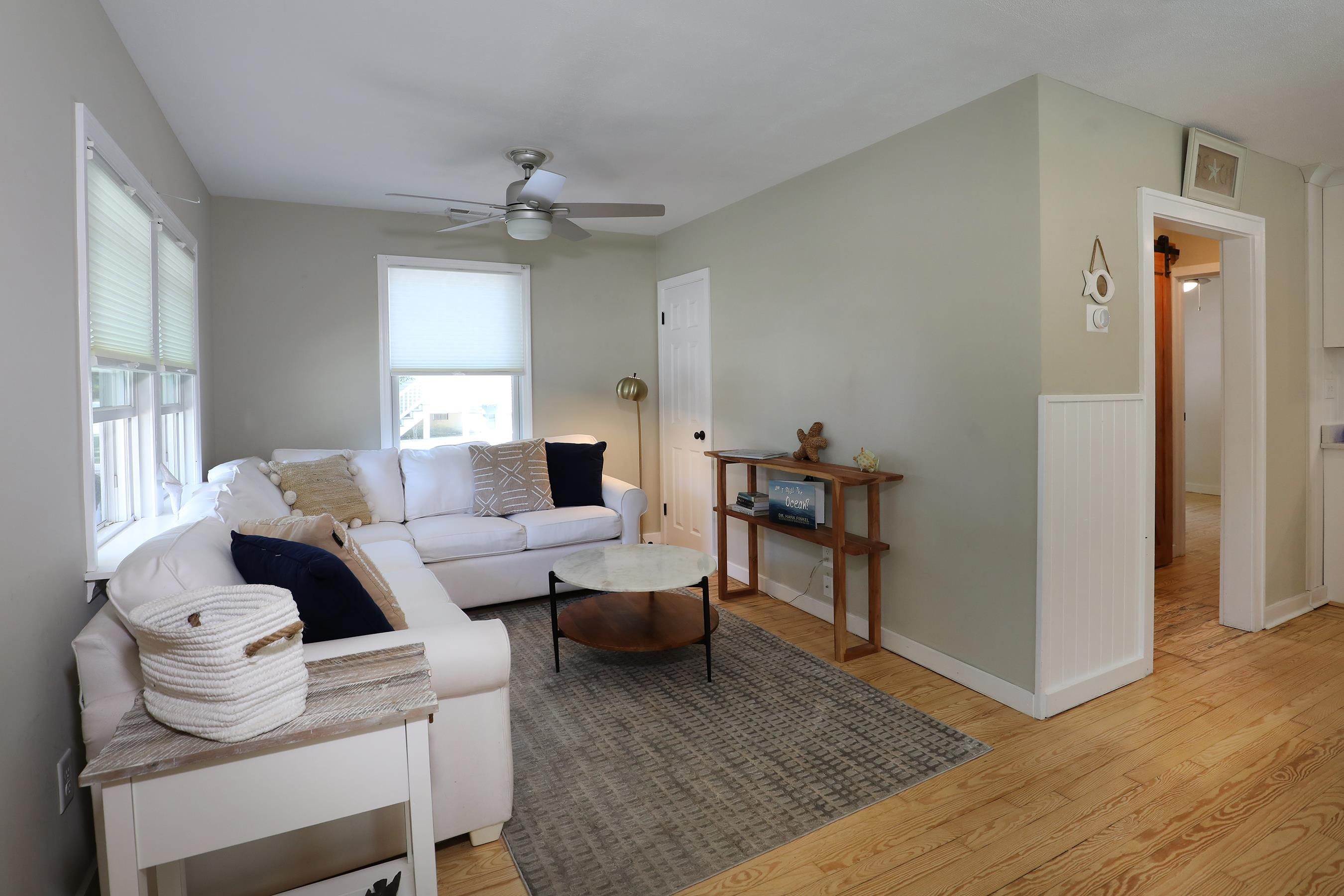 21 Beverly Road Cape May, NJ 08204 - Photo 16 of 38 a living room with furniture and a wooden floor