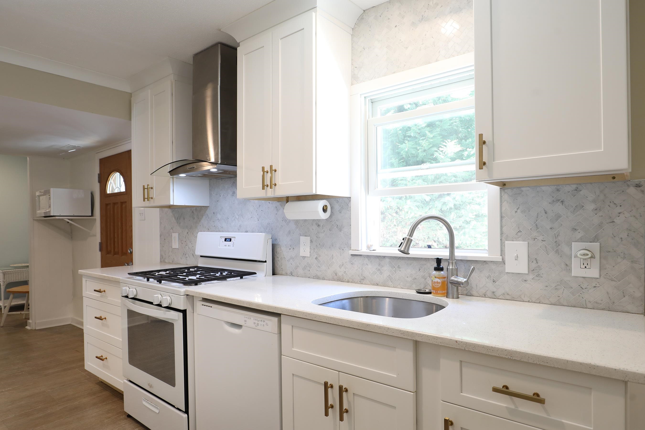 21 Beverly Road Cape May, NJ 08204 - Photo 19 of 38 a kitchen with granite countertop a sink stainless steel appliances and cabinets