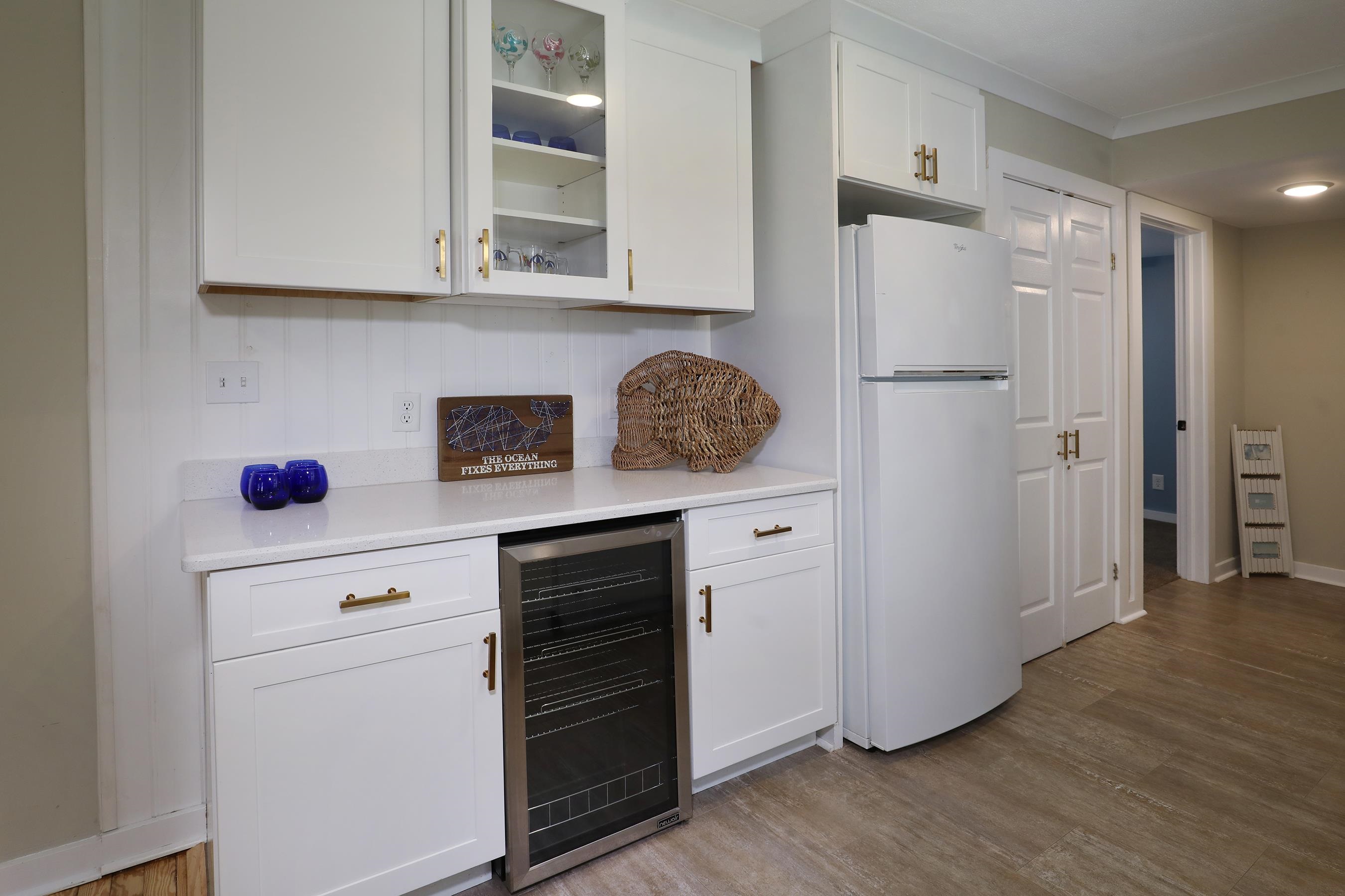 21 Beverly Road Cape May, NJ 08204 - Photo 20 of 38 a kitchen with stainless steel appliances white cabinets and a refrigerator
