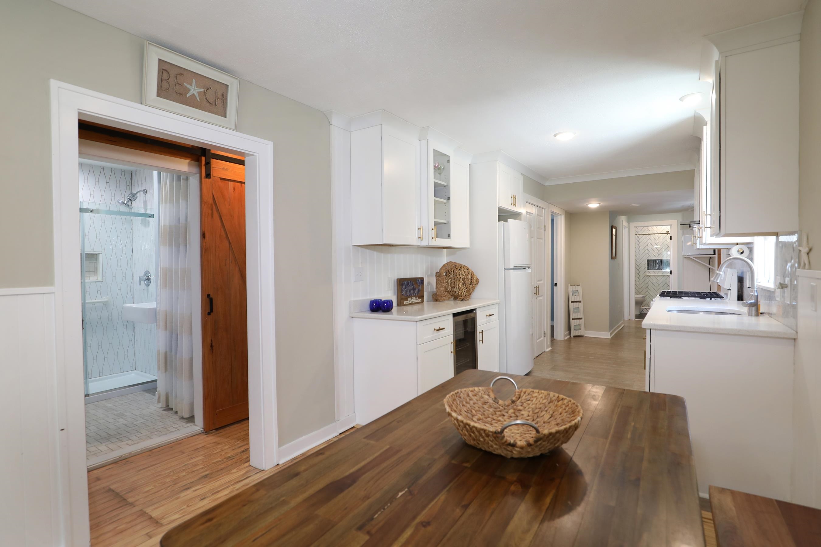 21 Beverly Road Cape May, NJ 08204 - Photo 22 of 38 a kitchen with a table and appliances