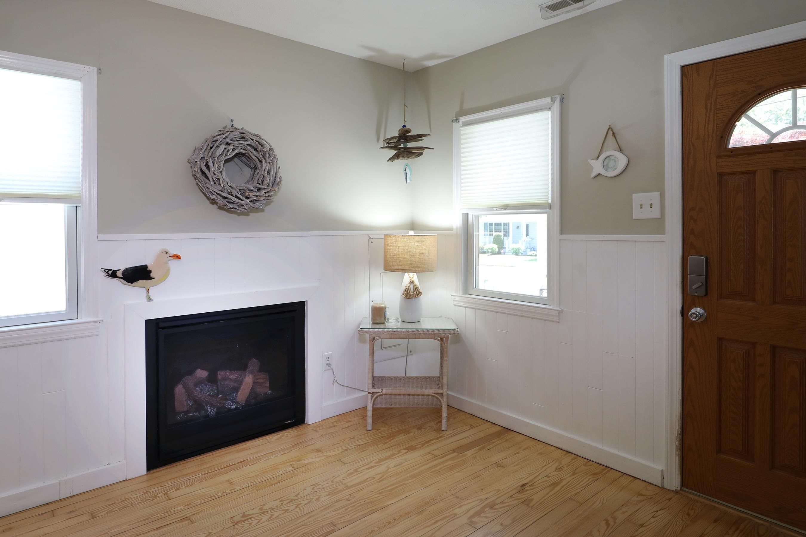 21 Beverly Road Cape May, NJ 08204 - Photo 23 of 38 a view of a livingroom with a fireplace and window