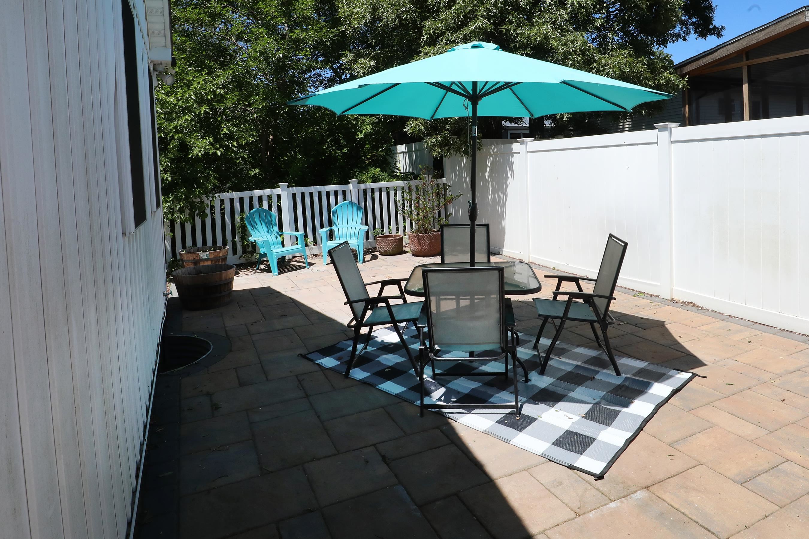 21 Beverly Road Cape May, NJ 08204 - Photo 7 of 38 a table and chairs in patio