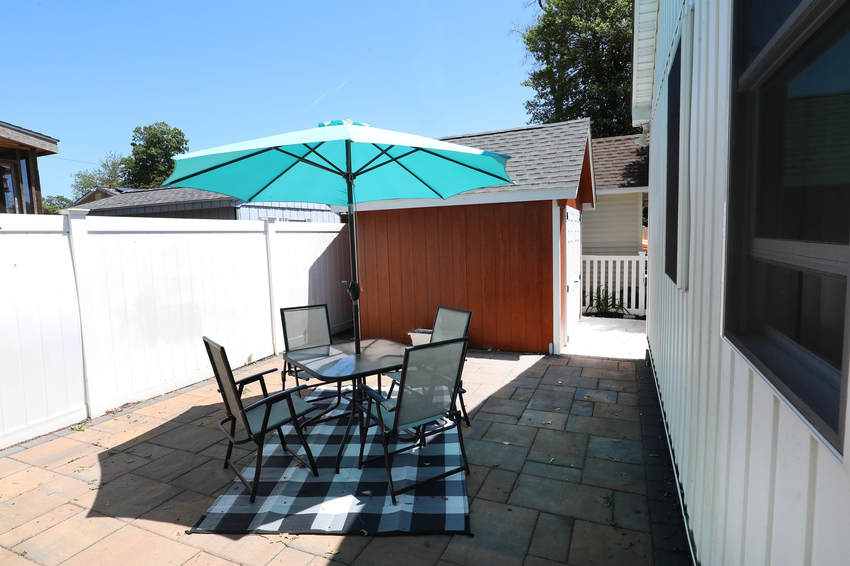 21 Beverly Road Cape May, NJ 08204 - Photo 10 of 38 a patio with table and chairs