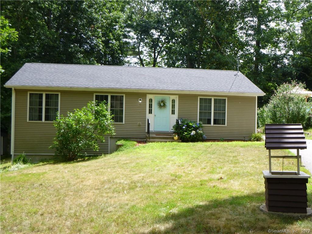 59 Forest Drive Salem, CT 06420 - Photo 1 of 1 a front view of a house with yard and green space