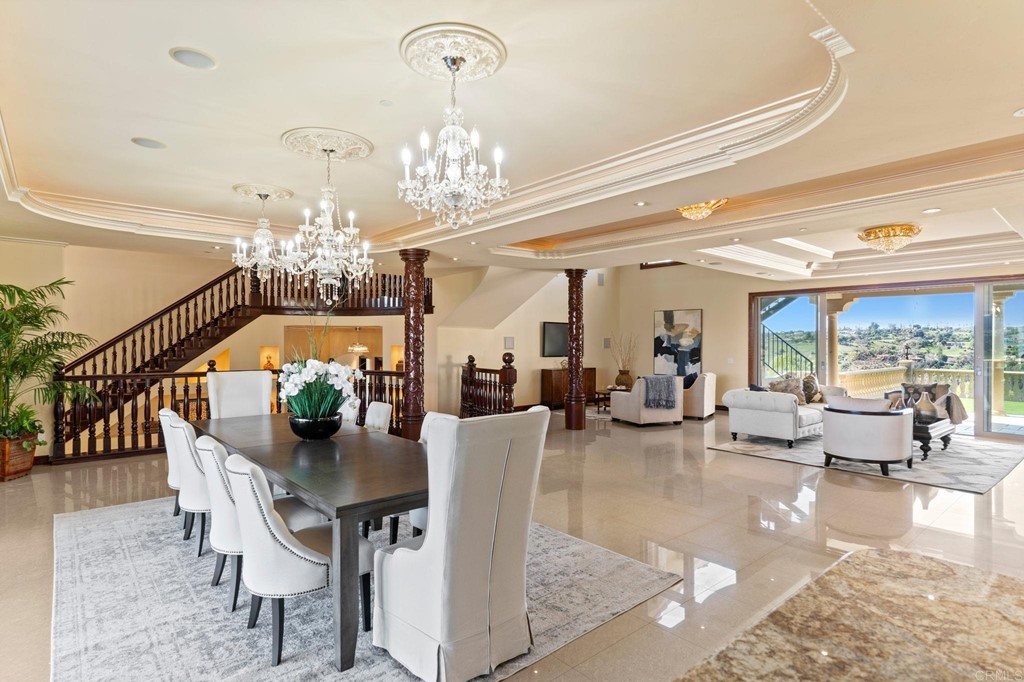 20895 Viento Valle Escondido, CA 92025 - Photo 13 of 75 a view of a dining room with furniture a chandelier and wooden floor