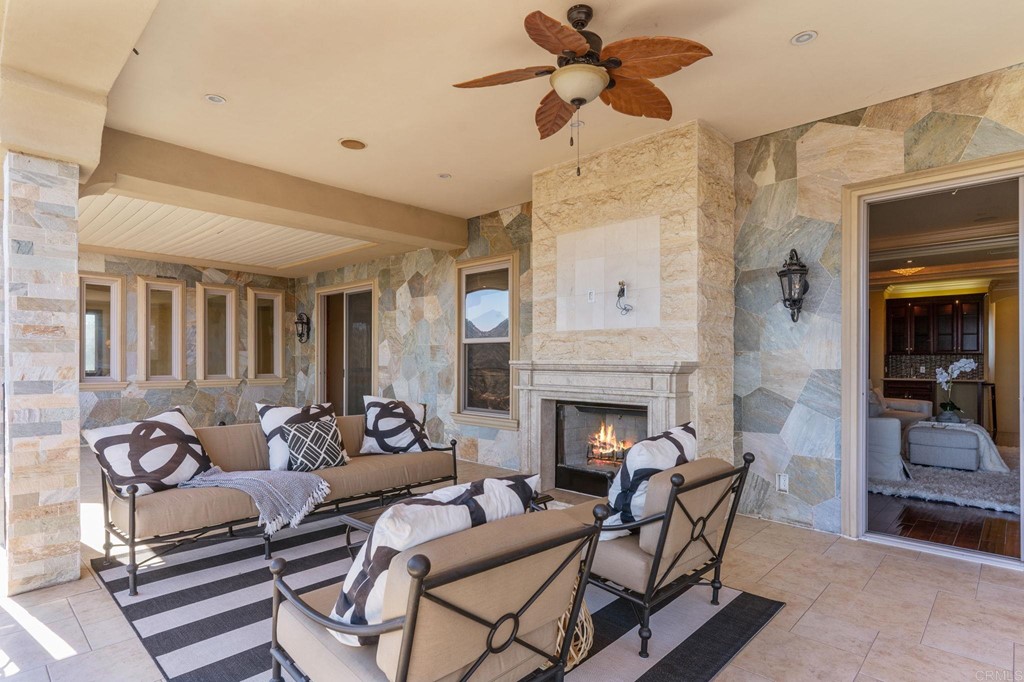 20895 Viento Valle Escondido, CA 92025 - Photo 31 of 75 a living room with furniture and a fireplace