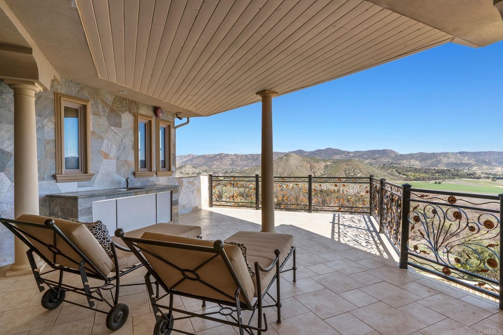 20895 Viento Valle Escondido, CA 92025 - Photo 33 of 75 a view of a chairs and table in the patio