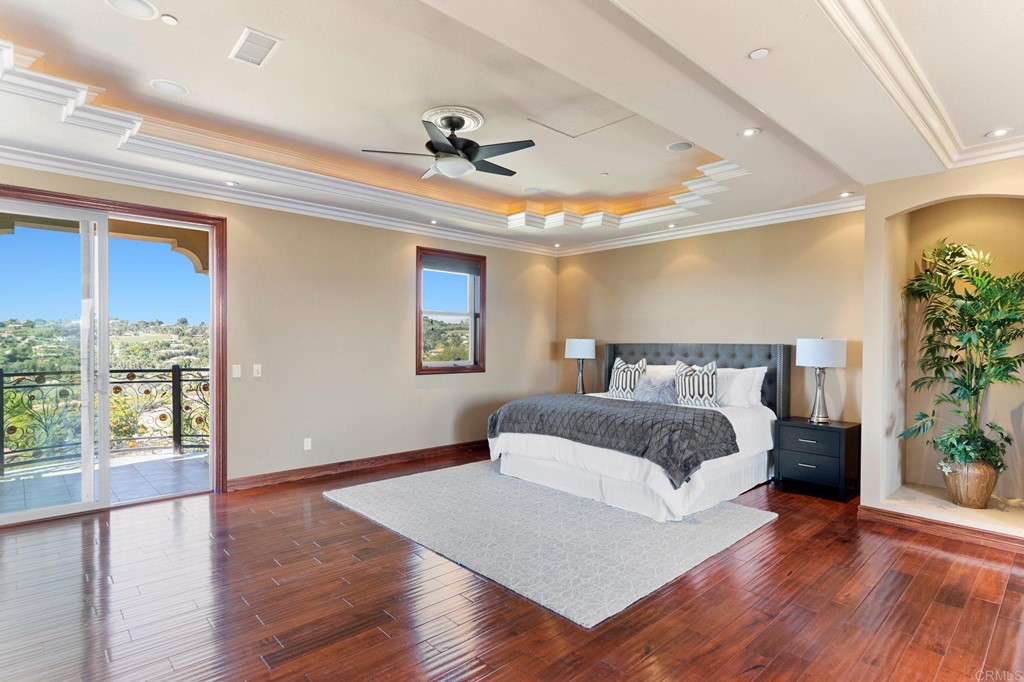 20895 Viento Valle Escondido, CA 92025 - Photo 40 of 75 a spacious bedroom with a large bed and a large window
