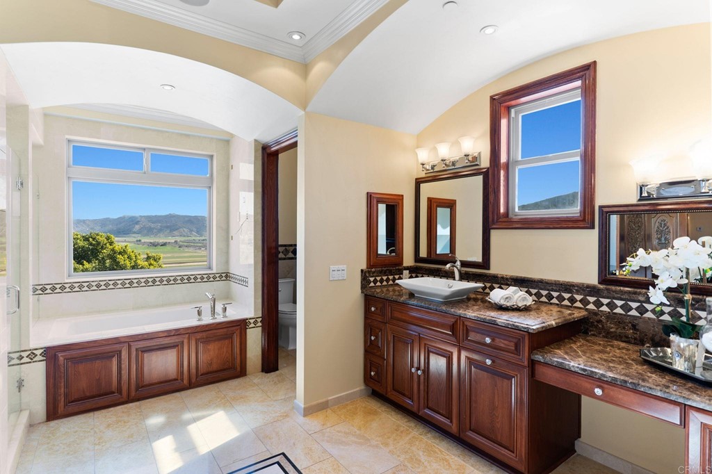 20895 Viento Valle Escondido, CA 92025 - Photo 42 of 75 a kitchen with stainless steel appliances granite countertop a stove and a sink