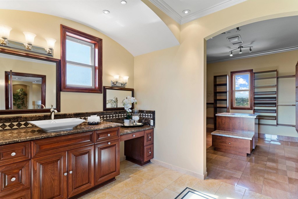 20895 Viento Valle Escondido, CA 92025 - Photo 43 of 75 a spacious bathroom with a granite countertop sink and a mirror