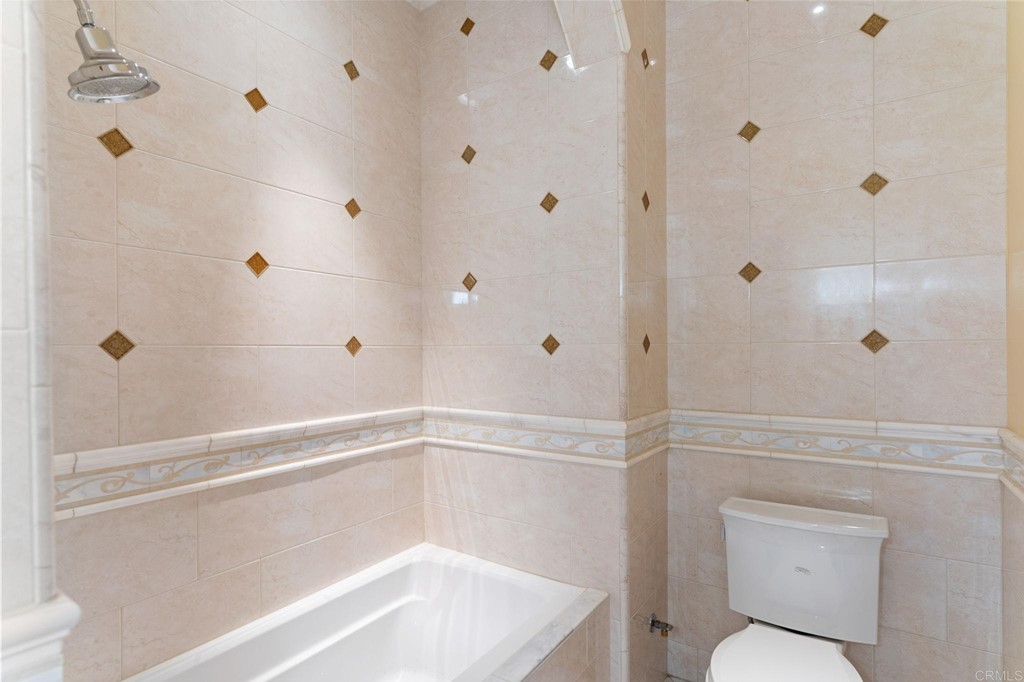 20895 Viento Valle Escondido, CA 92025 - Photo 49 of 75 a bathroom with a shower and toilet