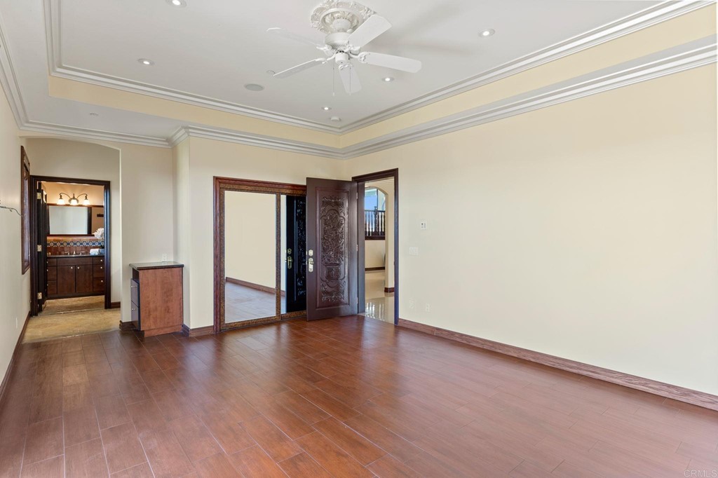 20895 Viento Valle Escondido, CA 92025 - Photo 53 of 75 an empty room with wooden floor and natural light