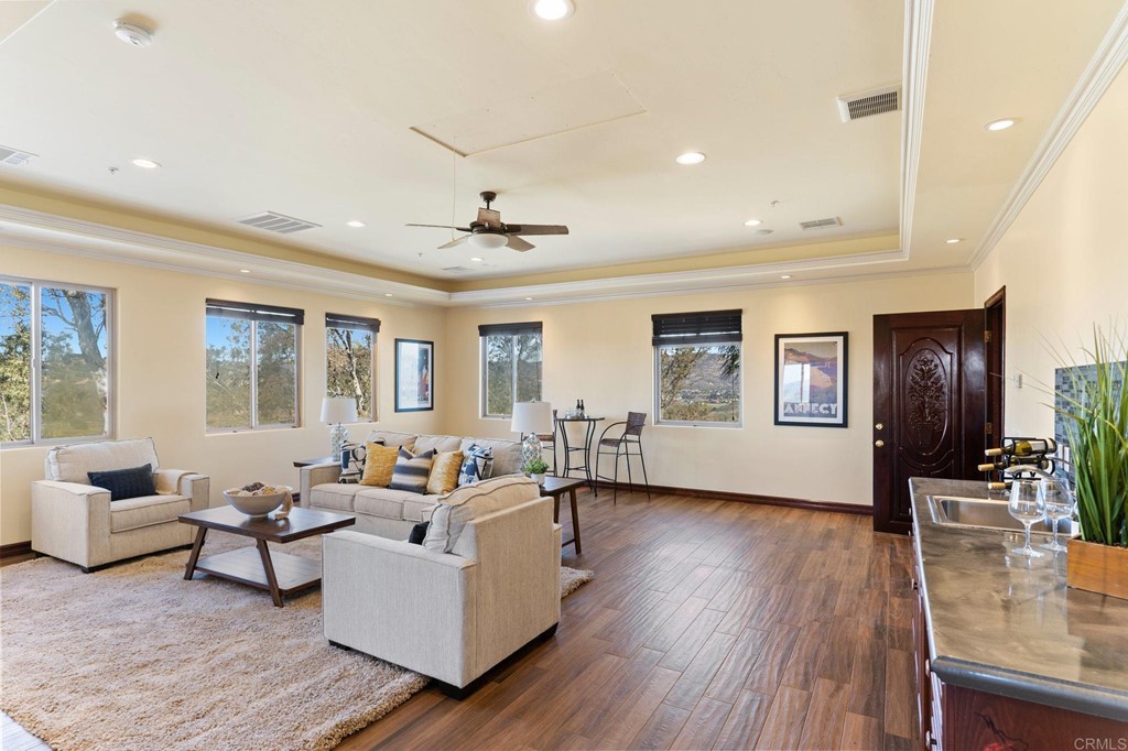 20895 Viento Valle Escondido, CA 92025 - Photo 58 of 75 a living room with furniture and a wooden floor