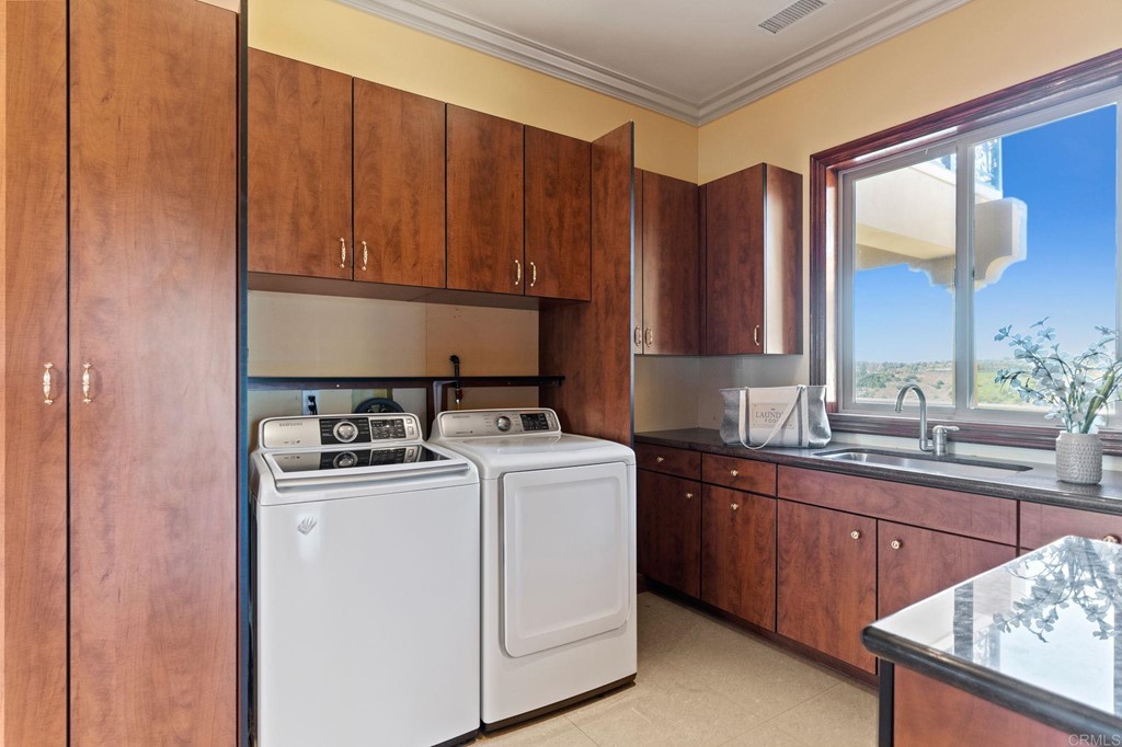 20895 Viento Valle Escondido, CA 92025 - Photo 64 of 75 a kitchen with a sink a stove and cabinets