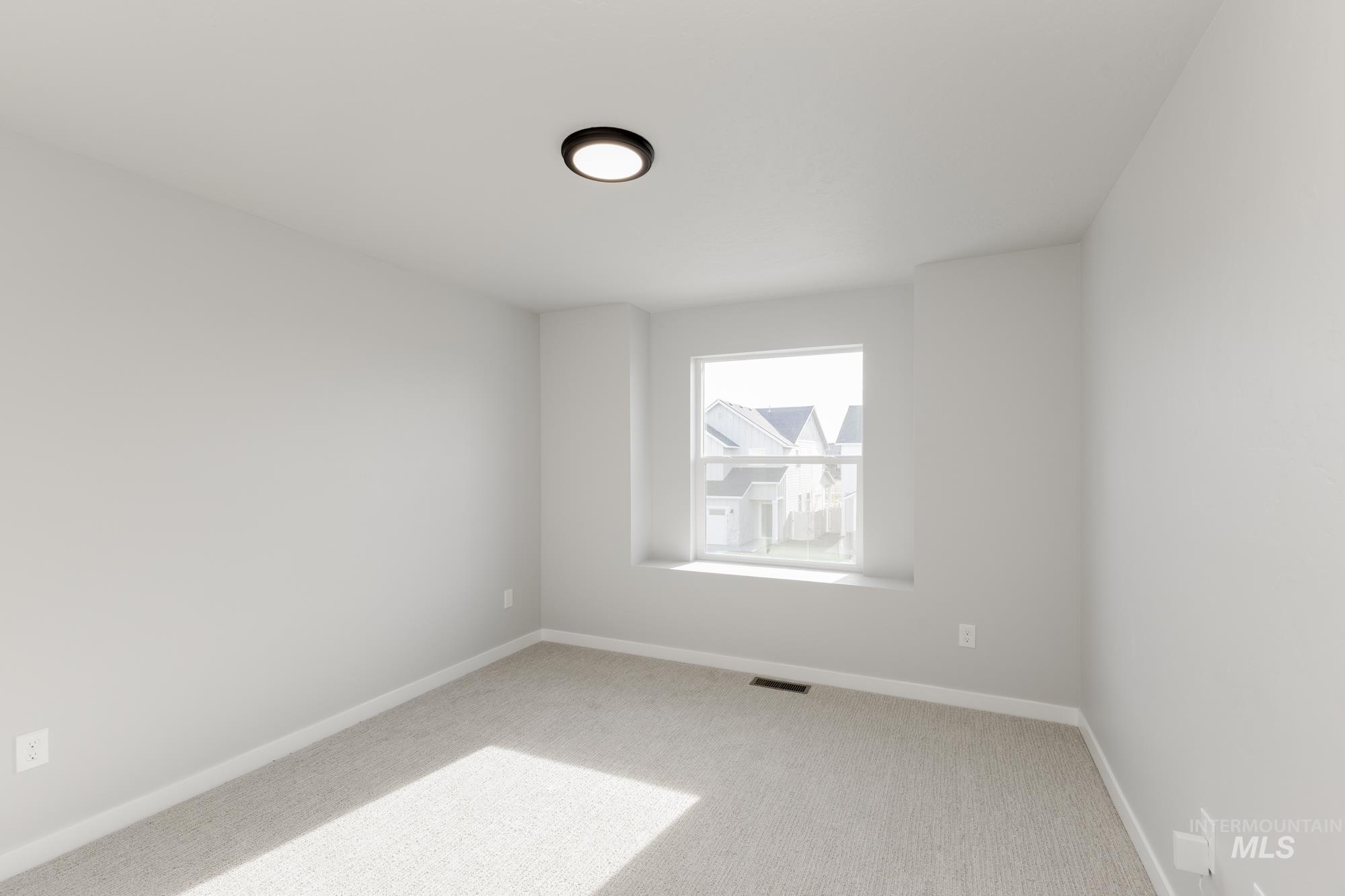 4166 East Kalinga Street Meridian, ID 83642 - Photo 13 of 22 Unfurnished room featuring carpet floors and baseboards
