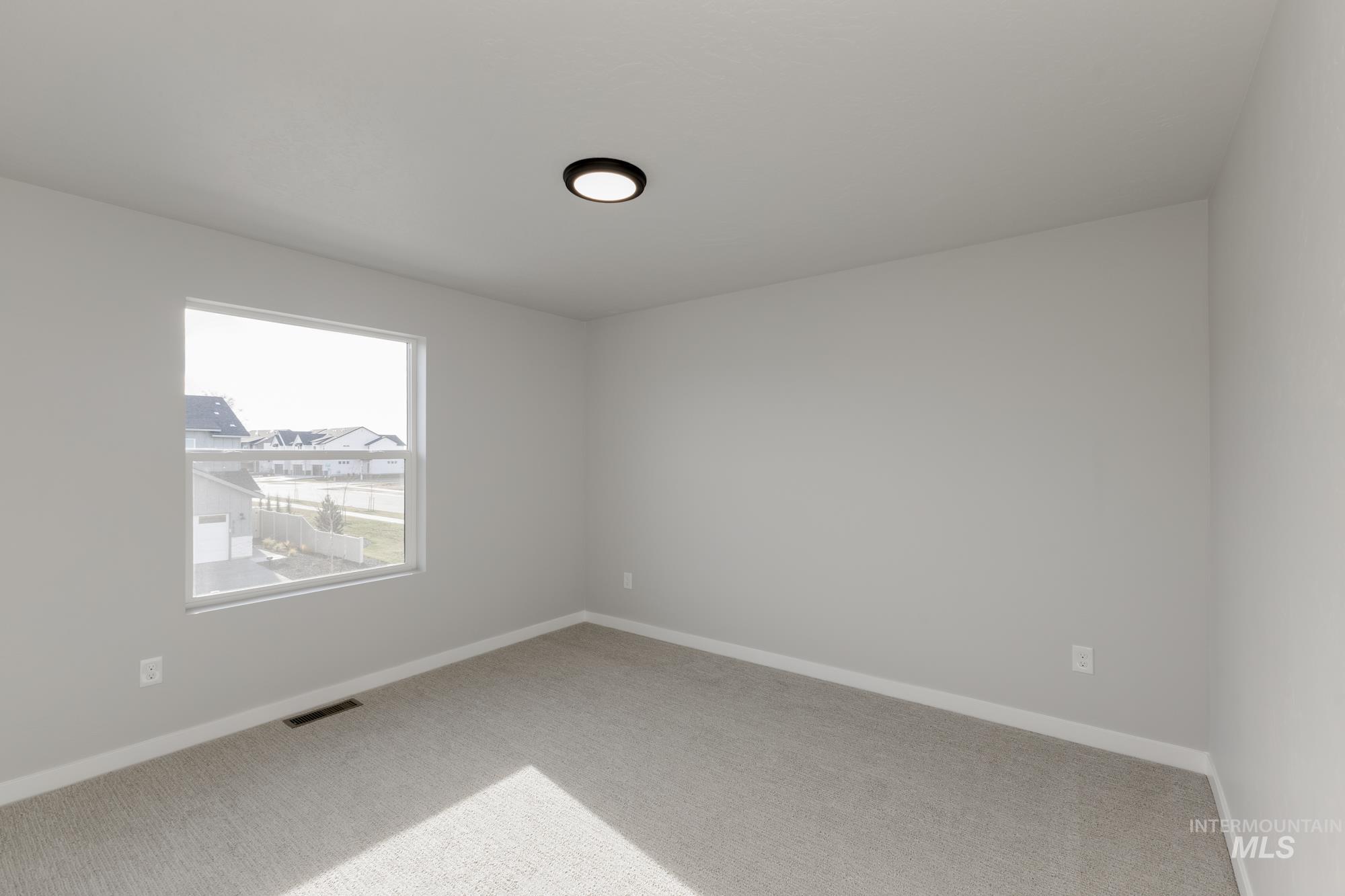 4166 East Kalinga Street Meridian, ID 83642 - Photo 14 of 22 Unfurnished room with carpet flooring