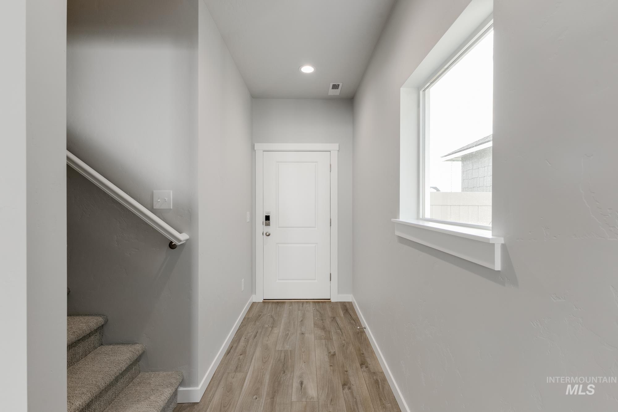 4166 East Kalinga Street Meridian, ID 83642 - Photo 3 of 22 Stairway featuring wood finished floors and recessed lighting