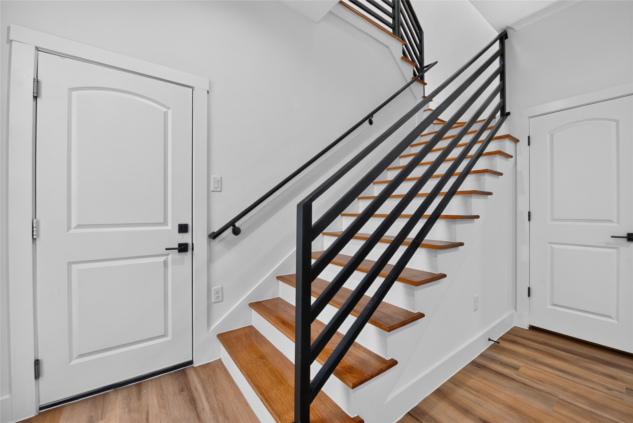 3537 Amos Street Houston, TX 77021 - Photo 19 of 32 A convenient garage entry opens directly into the living spaces, while steps to the side lead upstairs to the flex space, bedrooms, and baths.