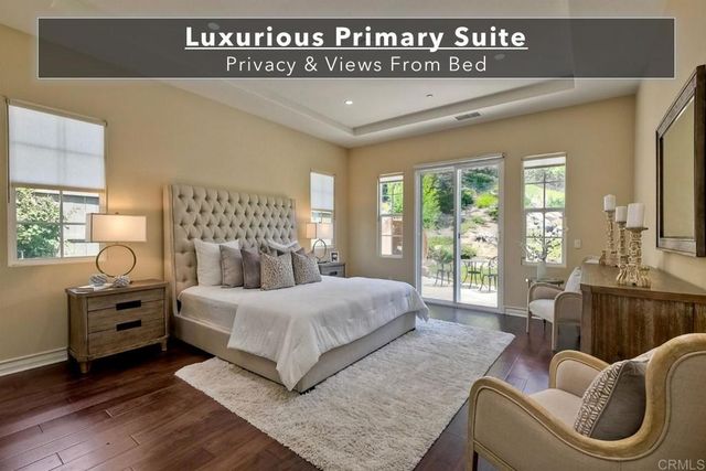a bathroom with a granite countertop sink toilet and mirror