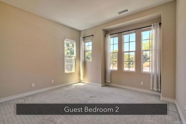 a view of a chairs and table in the patio