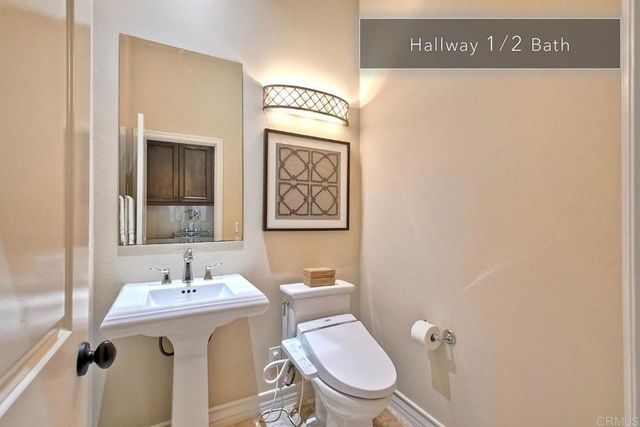 an aerial view of multiple houses with a yard