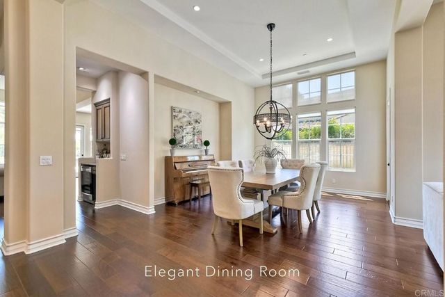a view of dining room with furniture window and wooden floor