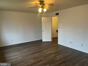 12 Pine Woods Court Reading, PA 19607 - Photo 9 of 10 a view of a livingroom with wooden floor and a ceiling fan