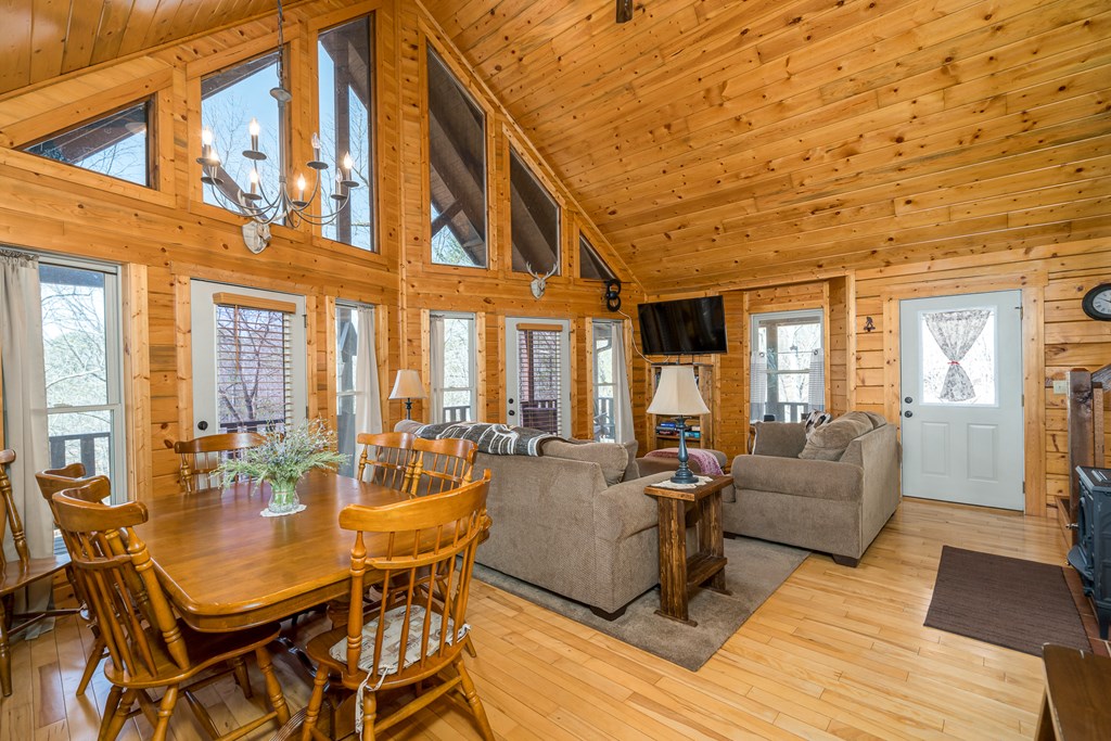1529 Faith Court Ranger, GA 30734 - Photo 15 of 50 a living room with furniture a large window and wooden floor