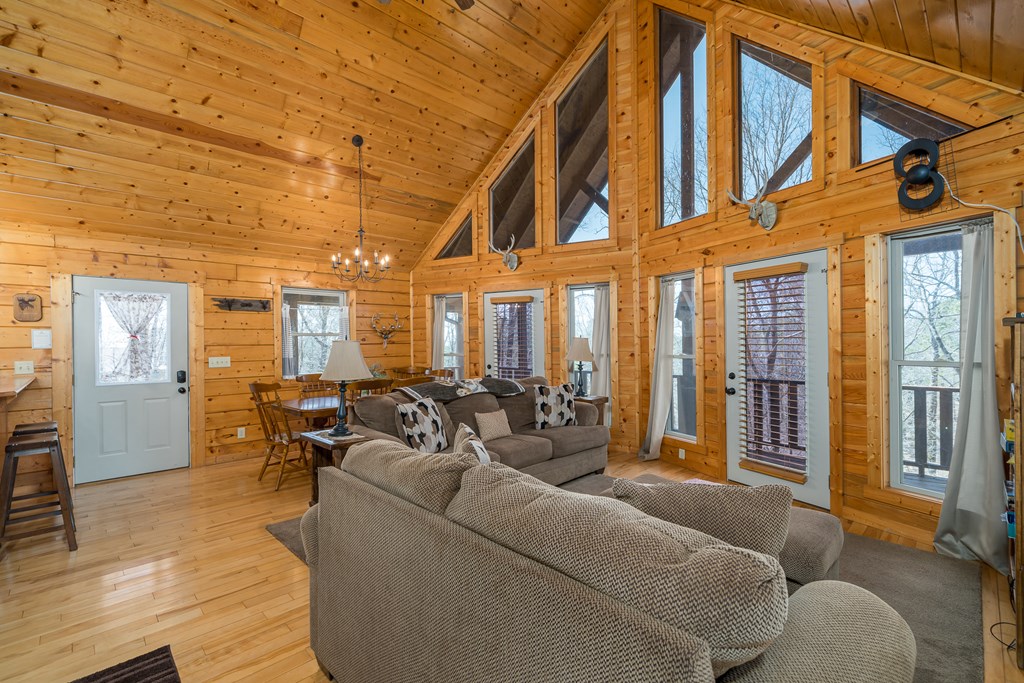 1529 Faith Court Ranger, GA 30734 - Photo 20 of 50 a living room with furniture ceiling fan and a rug