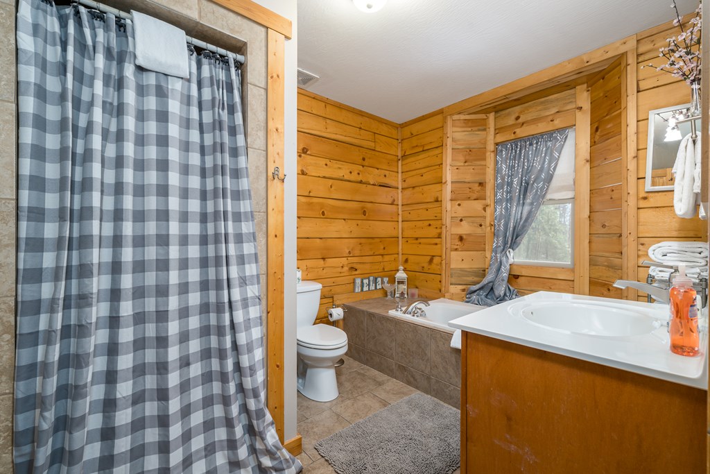 1529 Faith Court Ranger, GA 30734 - Photo 27 of 50 a bathroom with a sink toilet and shower