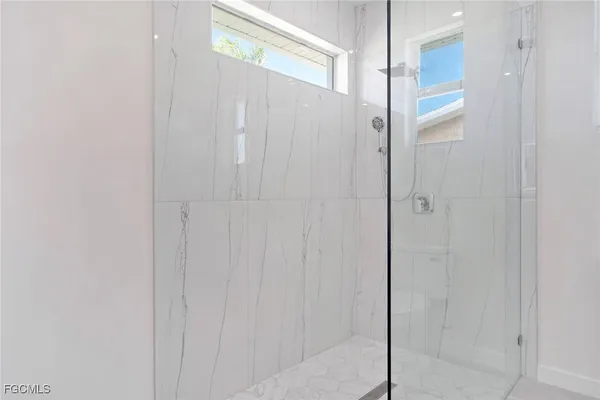 an empty room that has a window in it