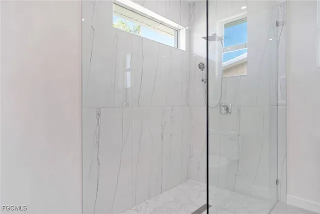 an empty room that has a window in it