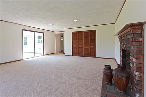 11 Irene Road Framingham, MA 01701 - Photo 8 of 16 a view of an empty room with a fireplace