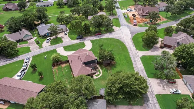 an aerial view of a house with a garden