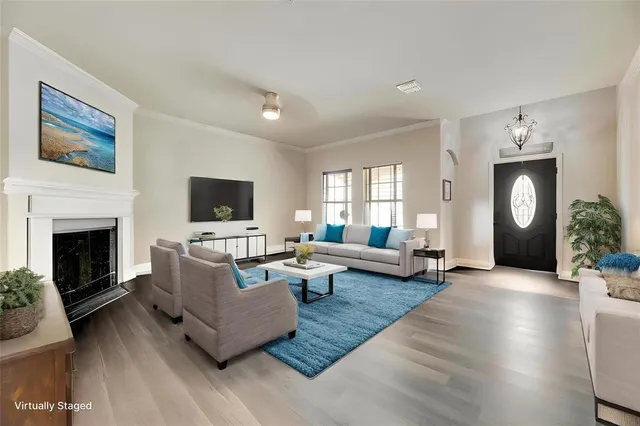 a living room with couches and a fireplace