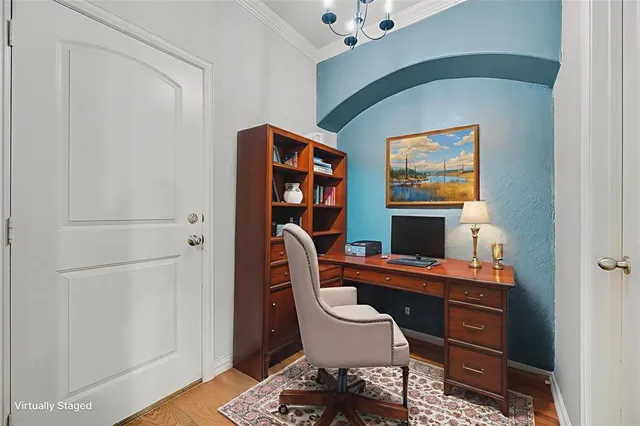 a reading room with furniture a lamp and a window