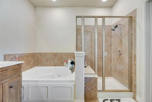 a bathroom with a bathtub and a shower
