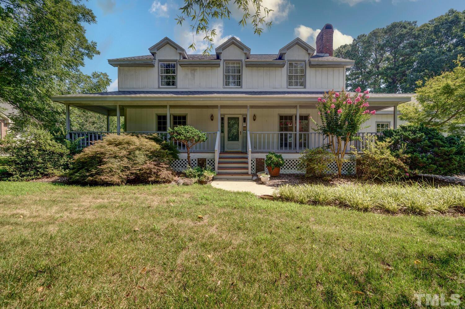 3908 Inland Court Raleigh, NC 27606 - Photo 3 of 3 a front view of a house with garden