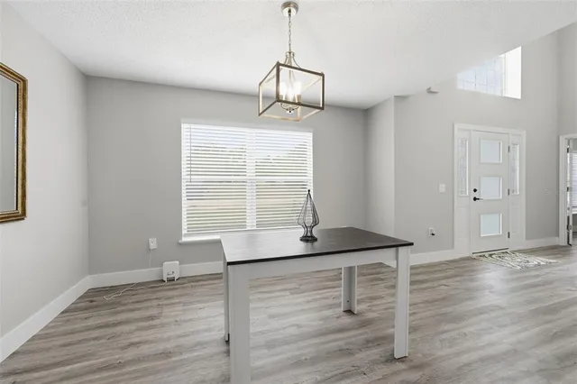 a bathroom with a sink a mirror and a window
