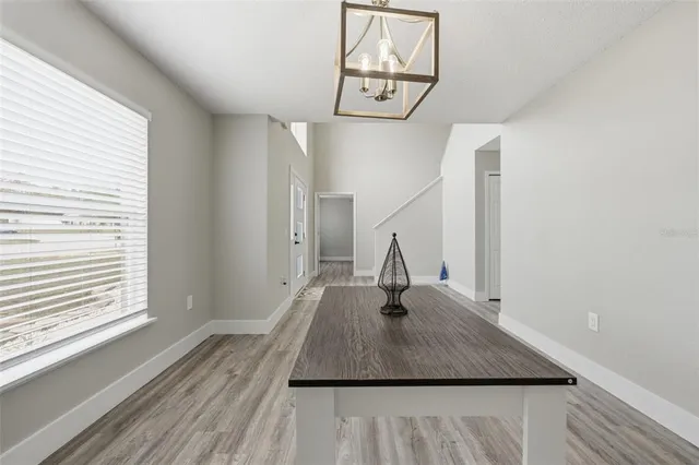 a bathroom with a bathtub sink a mirror and vanity