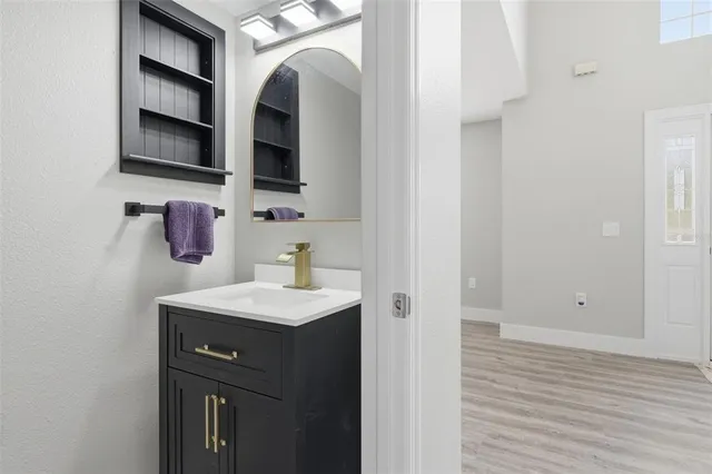 a kitchen with stainless steel appliances a refrigerator sink and microwave