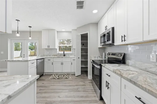 a view of storage and utility room with washer and dryer