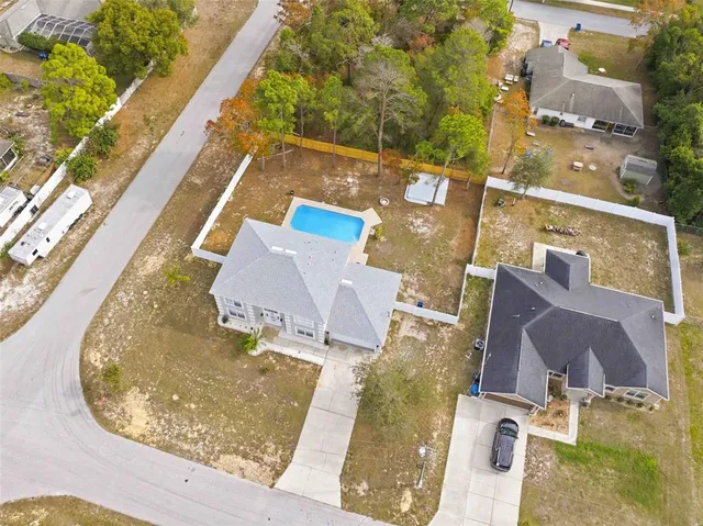 a view of a swimming pool with an outdoor seating