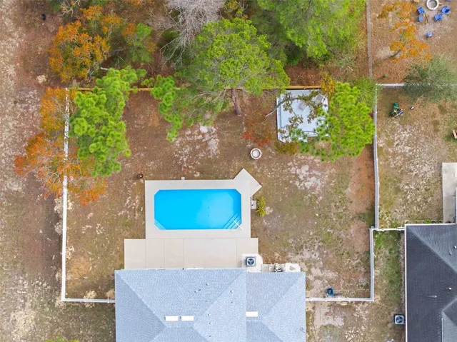 a view of a swimming pool with an outdoor seating
