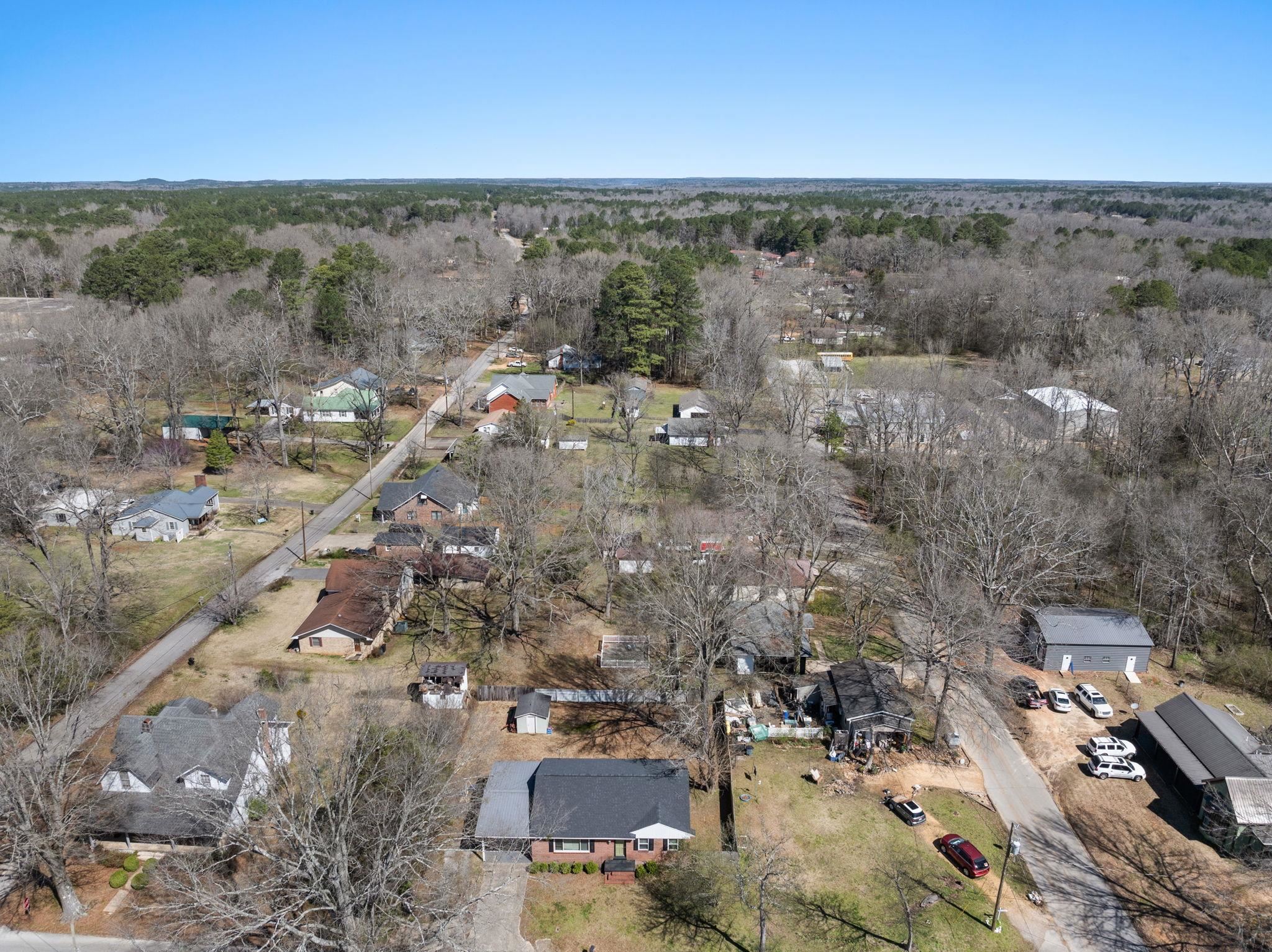 102 West 5th Street Iuka, MS 38852 - Photo 25 of 33 Aerial perspective showcasing a residential area with varied housing styles