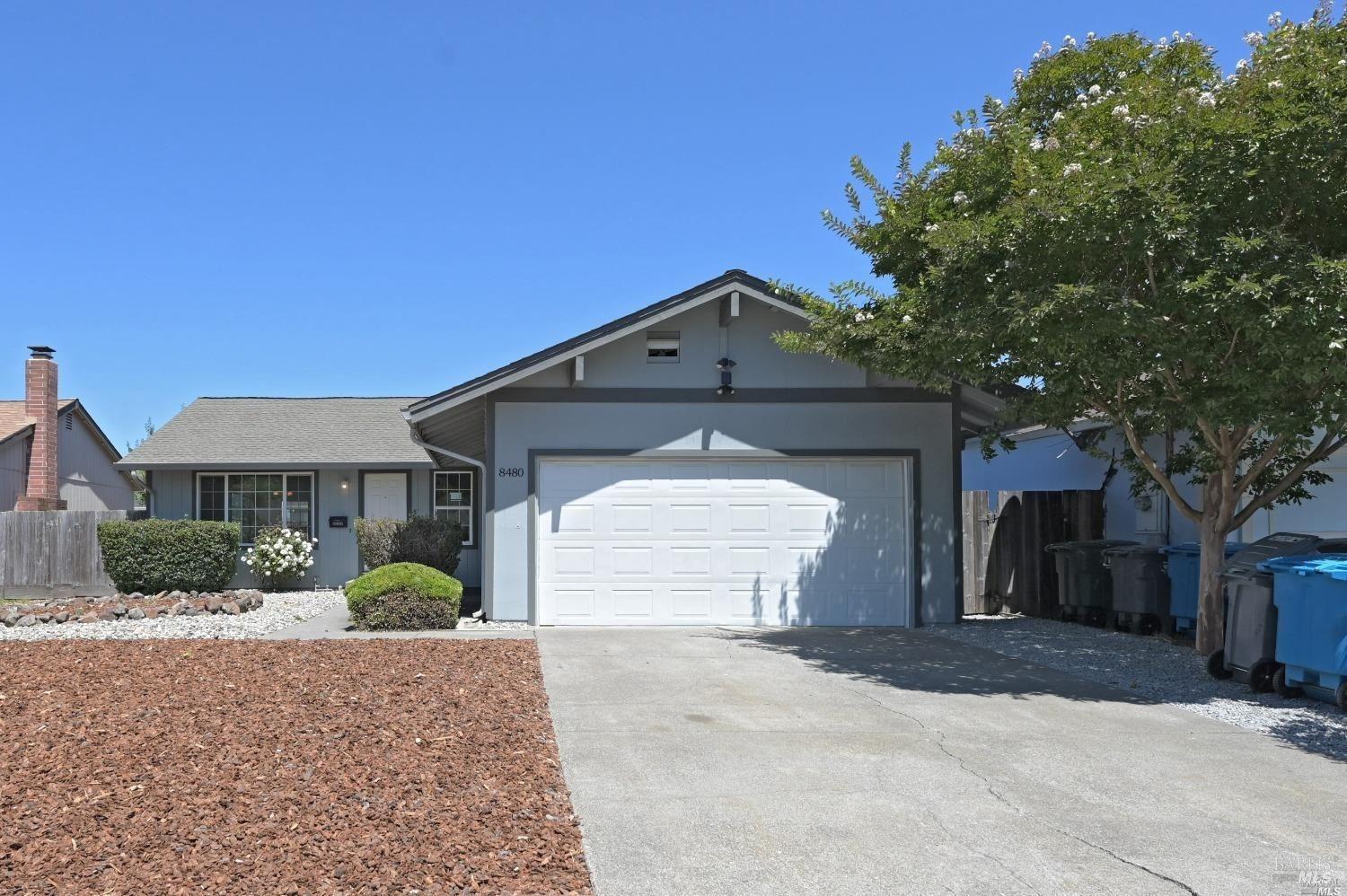 8480-8480 Loretto Avenue Cotati, CA 94931 - Photo 1 of 1 a front view of a house with a yard and garage